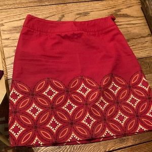 8 Petite Talbots skirts embroidered with geometric design and small beads.